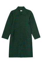 Green patterned dress on a white background