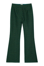 Green patterned pants on a white background