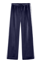 Navy blue satin pajama pants with a white stripe on a white background.